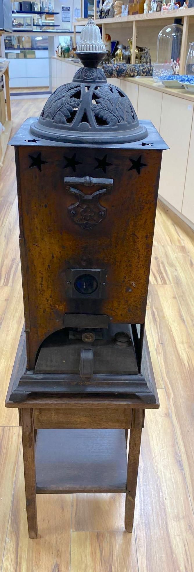 A Rippingilles Patent ABC Stove, Albion Lamp Co., oxidised copper frame, with leaded stained glass panel, circa 1860, 64cm high